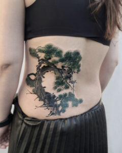 Pine tree cover-up tattoo
