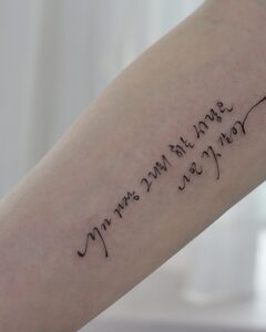 Korean brush-script lettering tattoo on the arm, Seoul