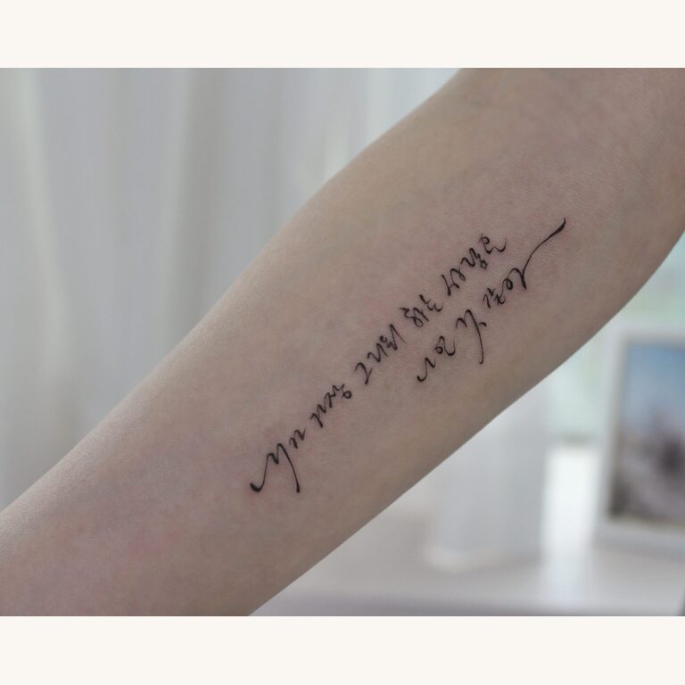 Korean brush-script lettering tattoo on the arm, Seoul